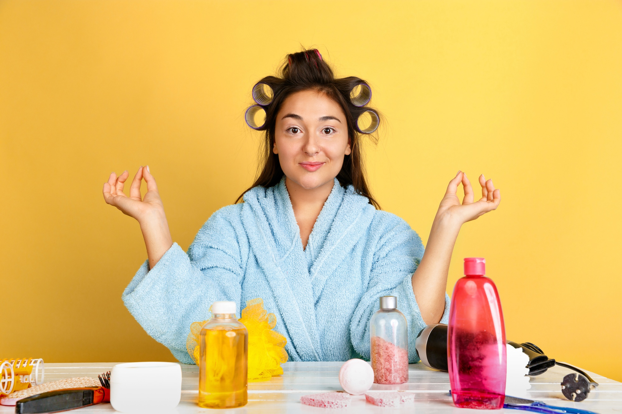 Here's the alt text for that image:

Alt text:

    "A person with thick, healthy hair surrounded by various hair care products designed to promote hair health and prevent hair loss.